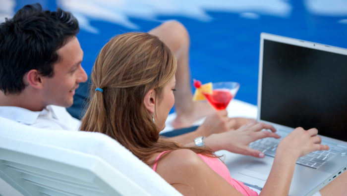 Couple using free Wi-Fi at the resort